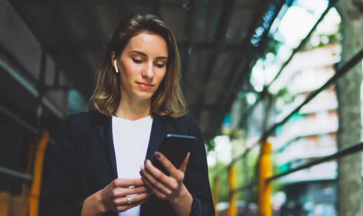 Business partners shaking hands at a table, symbolizing a reliable partnership with LYNKED for utility solutions