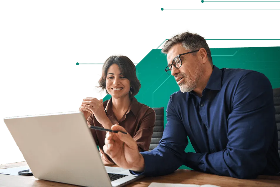 Two professionals reviewing utility data on a computer, representing reliable and smart submetering solutions